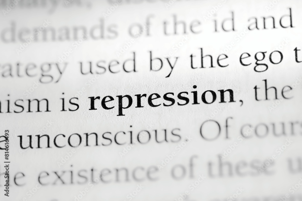 Close-up of the psychological defense mechanism term 'Repression' printed in black on white paper Close-up of the psychological defense mechanism term 'Repression' printed in black on white paper