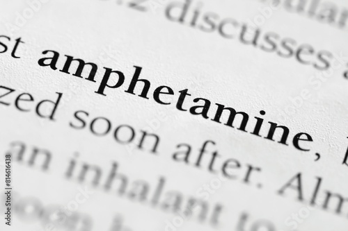 Closeup of the medical or addictive pharmacology term 'Amphetamine' in black on white paper