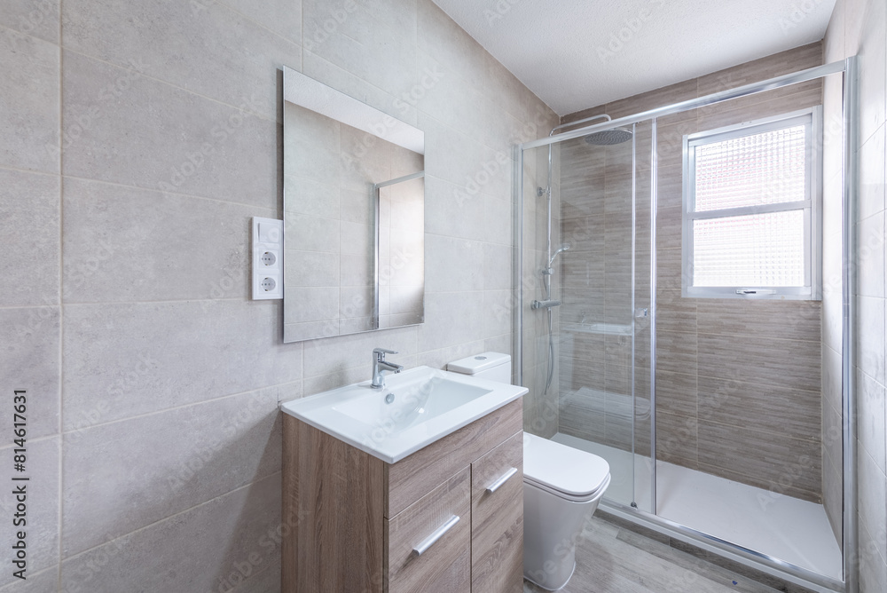 Modern bathroom in empty apartment with neutral tones