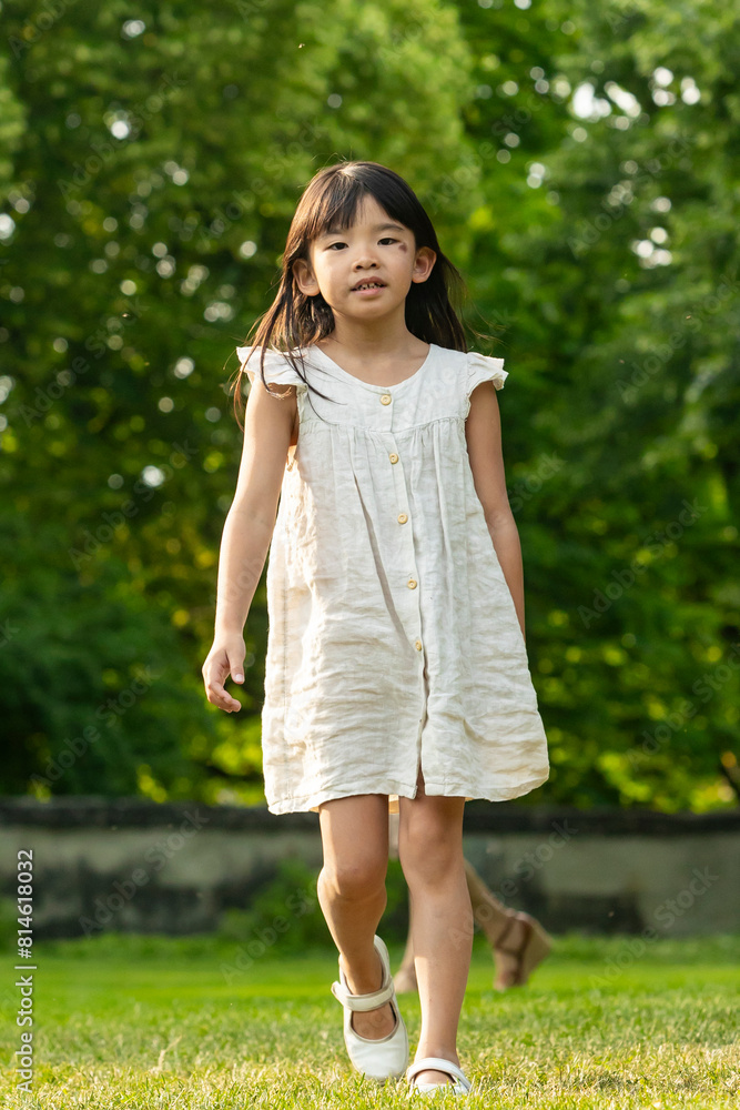 Young Asian girl exploring a park in Europe Young Asian girl exploring a park in Europe