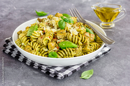 Basil Pesto Chicken Pasta with Fresh Cheese and Fresh Basil Leaves, Olive Oil Low Angle Close Up Photo
