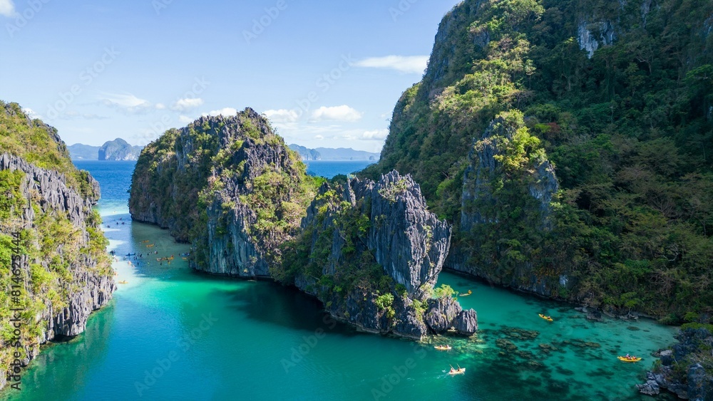some green mountains and clear water in a body of water some green mountains and clear water in a body of water