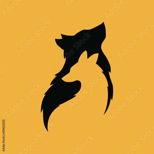 Silhouette of a wolf on a vibrant orange background