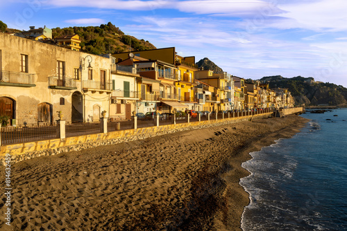 Fototapeta Naklejka Na Ścianę i Meble -  morning sunrise landscape on a city emnarkment with beach and sea coast and beautiful mediterranean street with buildings