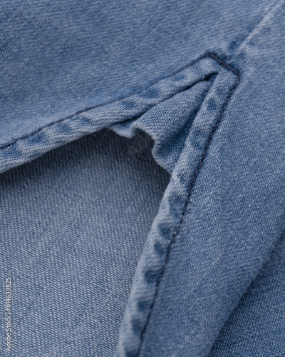 Rounded hem with a slit of a denim shirt