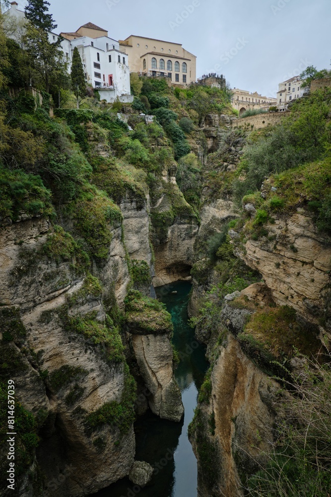 a narrow gorge in the middle of a rocky gorge near buildings a narrow gorge in the middle of a rocky gorge near buildings