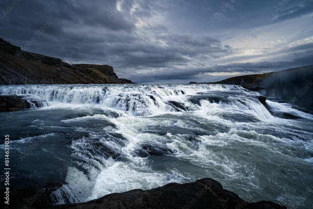a waterfall at dusk, just after the rain came to its end a waterfall at dusk, just after the rain came to its end