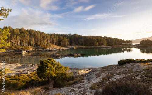 Obraz na płótnie A phenomenal golden hour sunset in Norway over the bay and fjords of Stord and the surrounding area w salonie