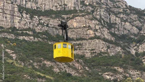 Mountain yellow cable car of Santa Cova on Montserrat mountain in Monistrol de Montserrat, Spain photo