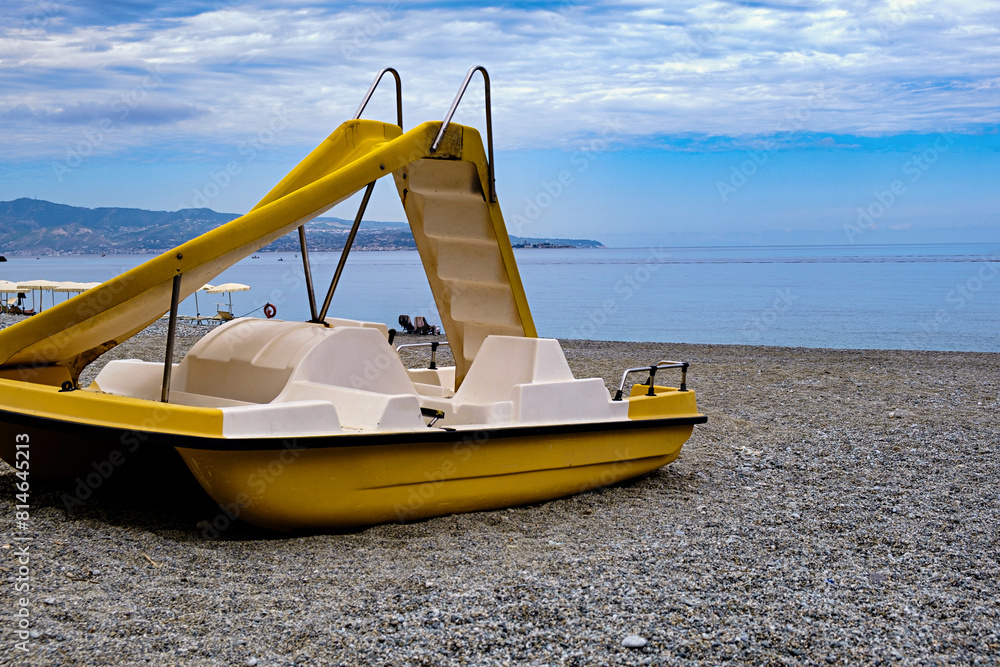 Yellow Pedal Boat with Slide - Tranquil Beach Scene Yellow Pedal Boat with Slide - Tranquil Beach Scene