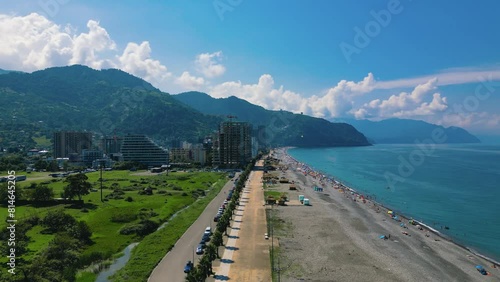 Drone footage of Gonio Beach and seafront buildings with mountains in the background, Gonio, Georgia photo