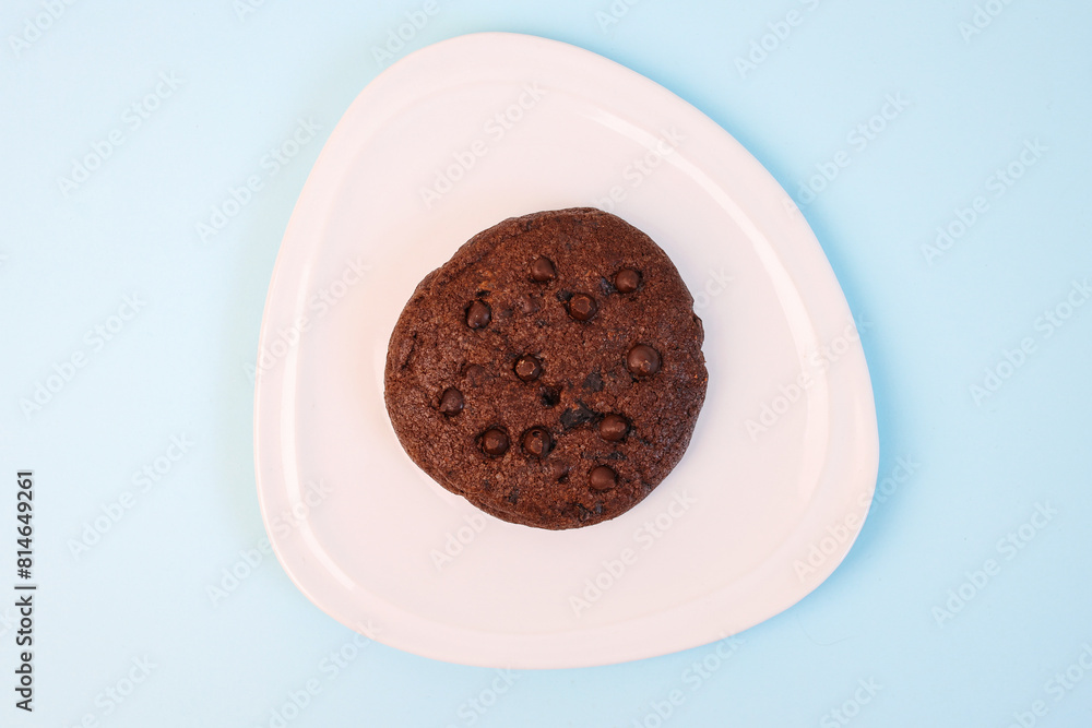 Chocolate Cookies On Plate Over Blue Background Chocolate Cookies On Plate Over Blue Background