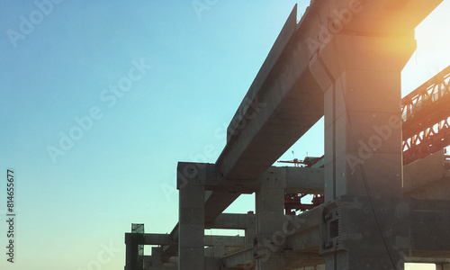 Onsite construction of sky expressway show main girder support structure with clear summer blue sky and sunlight. Image use for transportation presentation background.