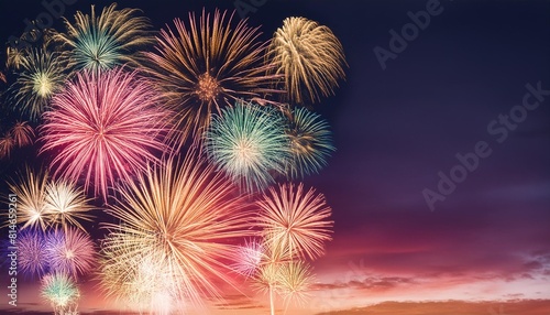 colorful firework celebration fireworks displaying up in the sky over dark background with copy space