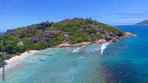 Grand Sister Island close to La Digue, Seychelles. Aerial view of tropical coastline on a sunny day © jovannig