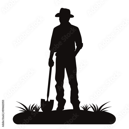 Farmer Silhouette with Shovel in Field