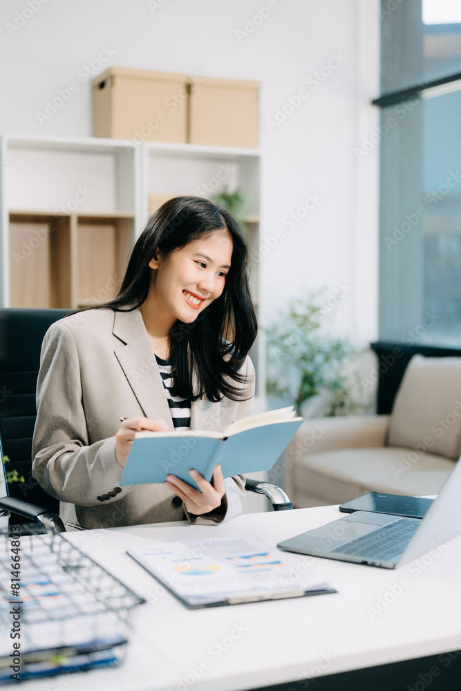 Business woman using tablet and laptop for doing math finance on an office desk, tax Business woman using tablet and laptop for doing math finance on an office desk, tax