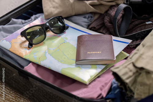 Young woman traveler packing suitcase preparing for travel on summer vacation
