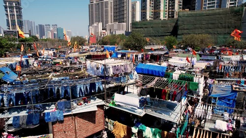 Dhobi ghat slums Mumbai, India, laundry area, Aerial view. The washers, known as dhobis, work in the open to clean clothes and linens from Mumbai's hotels and hospitals photo