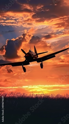 A motor plane flies through the sky during sunset, casting a silhouette against the colorful evening sky.
