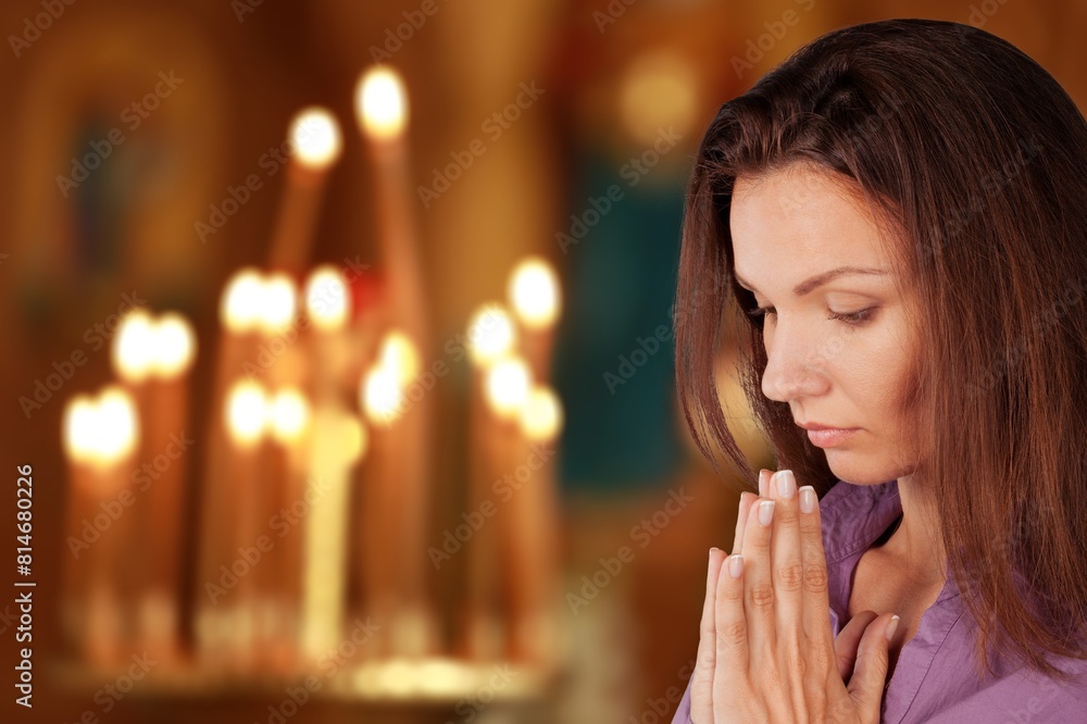 Christian Woman Praying in a Church. Religious Faith concept Christian Woman Praying in a Church. Religious Faith concept