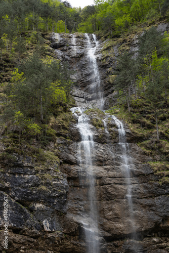 Rio di Repepeit. Wonderful waterfall that falls from a cliff. The force of the waterfall is a sight to behold. Hiking, trekking in the open area surrounded by woods. Summer holidays, peace.