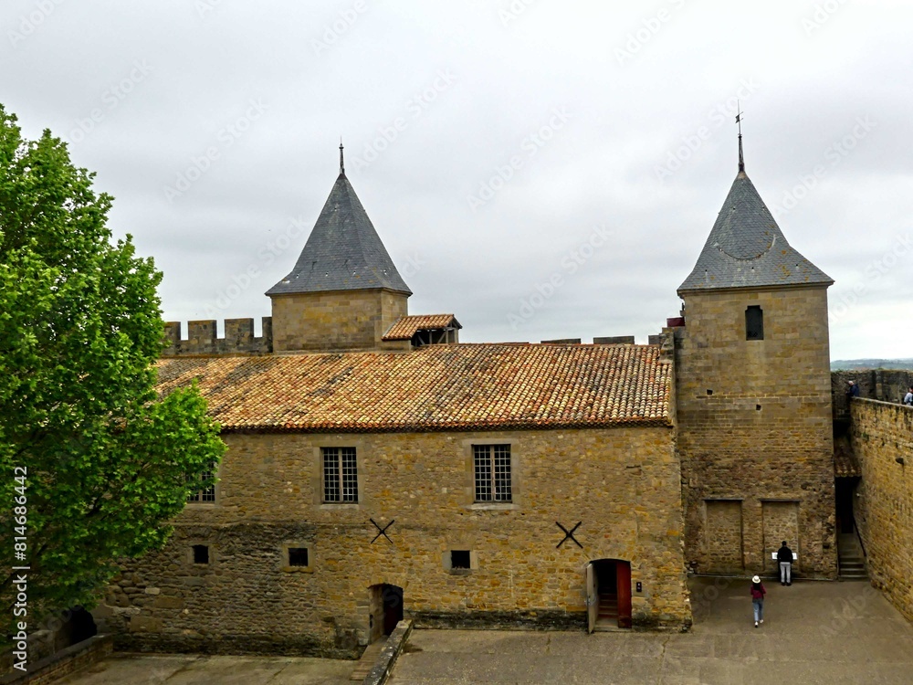 Carcassonne, May 2024: Visit the magnificent walled city of Carcassonne in Occitanie. Street photos - View of the fortified castle and ramparts protecting the historic town. Carcassonne, May 2024: Visit the magnificent walled city of Carcassonne in Occitanie. Street photos - View of the fortified castle and ramparts protecting the historic town.