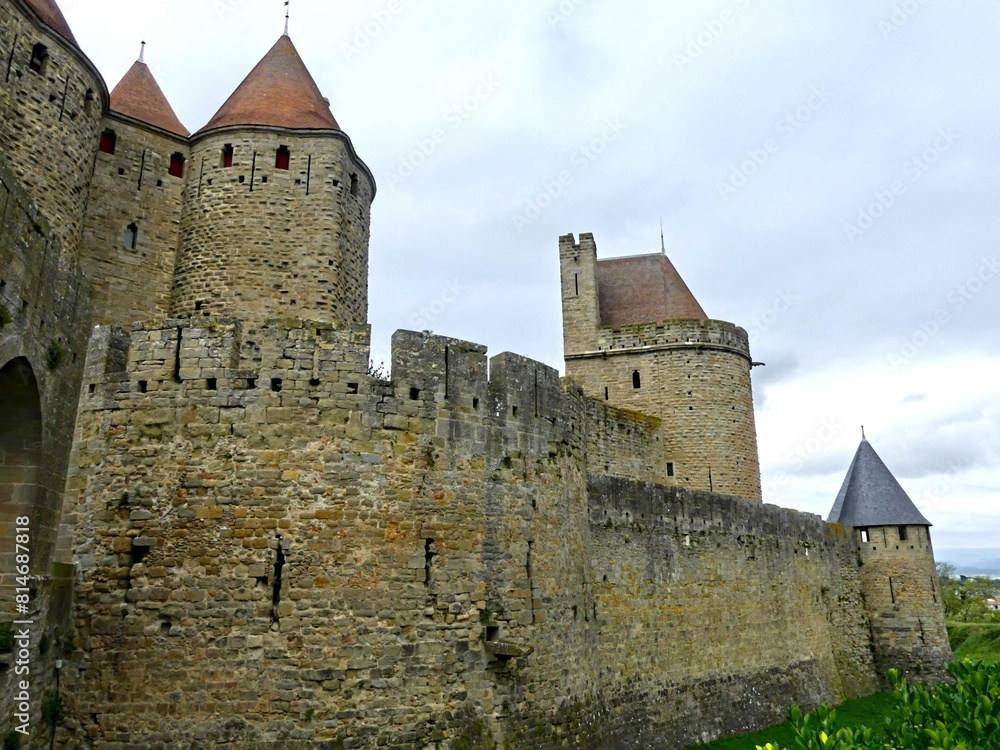 Carcassonne, May 2024: Visit the magnificent walled city of Carcassonne in Occitanie. Street photos - View of the fortified castle and ramparts protecting the historic town. Carcassonne, May 2024: Visit the magnificent walled city of Carcassonne in Occitanie. Street photos - View of the fortified castle and ramparts protecting the historic town.