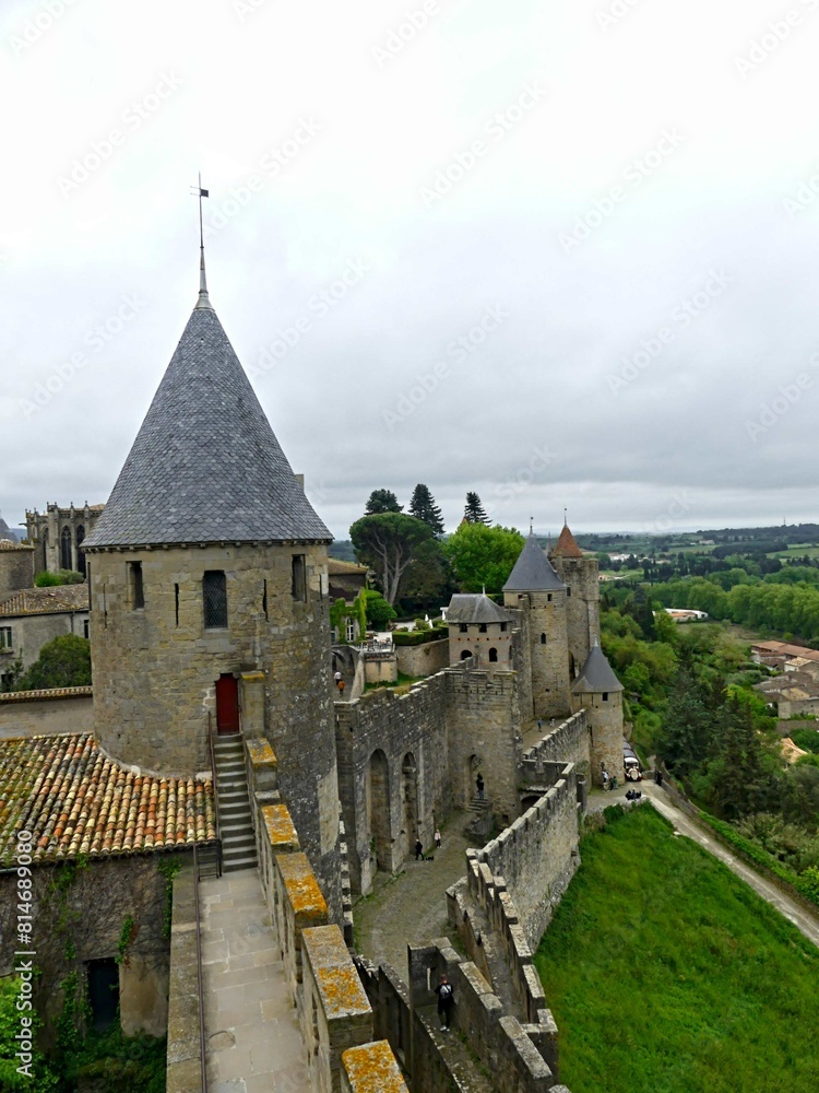 Carcassonne, May 2024: Visit the magnificent walled city of Carcassonne in Occitanie. Street photos - View of the fortified castle and ramparts protecting the historic town. Carcassonne, May 2024: Visit the magnificent walled city of Carcassonne in Occitanie. Street photos - View of the fortified castle and ramparts protecting the historic town.