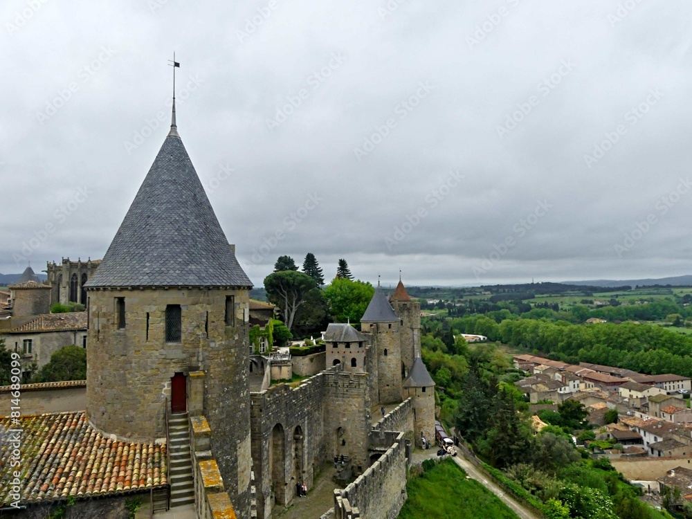 Carcassonne, May 2024: Visit the magnificent walled city of Carcassonne in Occitanie. Street photos - View of the fortified castle and ramparts protecting the historic town. Carcassonne, May 2024: Visit the magnificent walled city of Carcassonne in Occitanie. Street photos - View of the fortified castle and ramparts protecting the historic town.