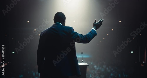 African Speaker with Expertise in Technology, Finance, Business, Politics, and Religion Coaching a Diverse Group of Young Specialists During a Presentation at a Strategic Growth Conference
