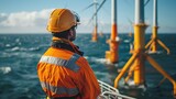Maintenance engineer standing on a service boat near an offshore wind farm. Portrait of a skilled professional preparing to work at height.