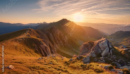 rugged beauty of a mountain range at golden hour with the sun setting in the background