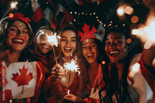 Diverse Friends Celebrating with Sparklers on Canada Day Night photo