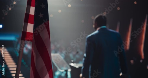 Political Party Representative Speaking at a Press Conference in Government Building. Press Officer Delivering a Speech at a Summit. Governor Talking at Congress. Stage with American Flags photo