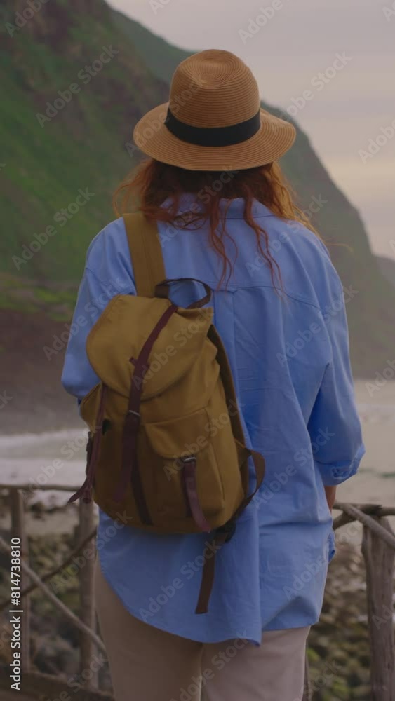 Camera follows woman hiker with backpack. Traveler hiker, enjoys nature and life. Traveling in the mountains, adventure in trip. Lifestyle concept. Woman walking on mountain trail in Madeira Camera follows woman hiker with backpack. Traveler hiker, enjoys nature and life. Traveling in the mountains, adventure in trip. Lifestyle concept. Woman walking on mountain trail in Madeira