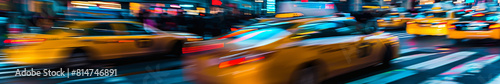 A blurry image of a busy city street with yellow taxis