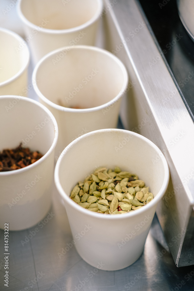 Cardamom spices for mulled wine in white paper cup. Cardamom spices for mulled wine in white paper cup.