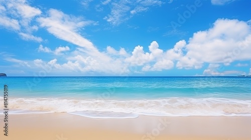 A wide panorama of a serene beach with glistening sand  gentle ocean waves  and a beautiful blue sky.