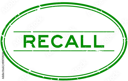 Grunge green recall word oval rubber seal stamp on white background