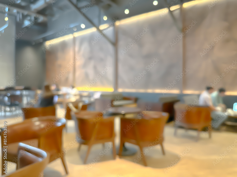 A blurred image of a modern coffee shop, elegantly decorated and warm, with customers happily working A blurred image of a modern coffee shop, elegantly decorated and warm, with customers happily working