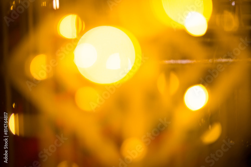 close-up blurred photo Golden decorative lights create a luxurious atmosphere at night events. Helps to take beautiful