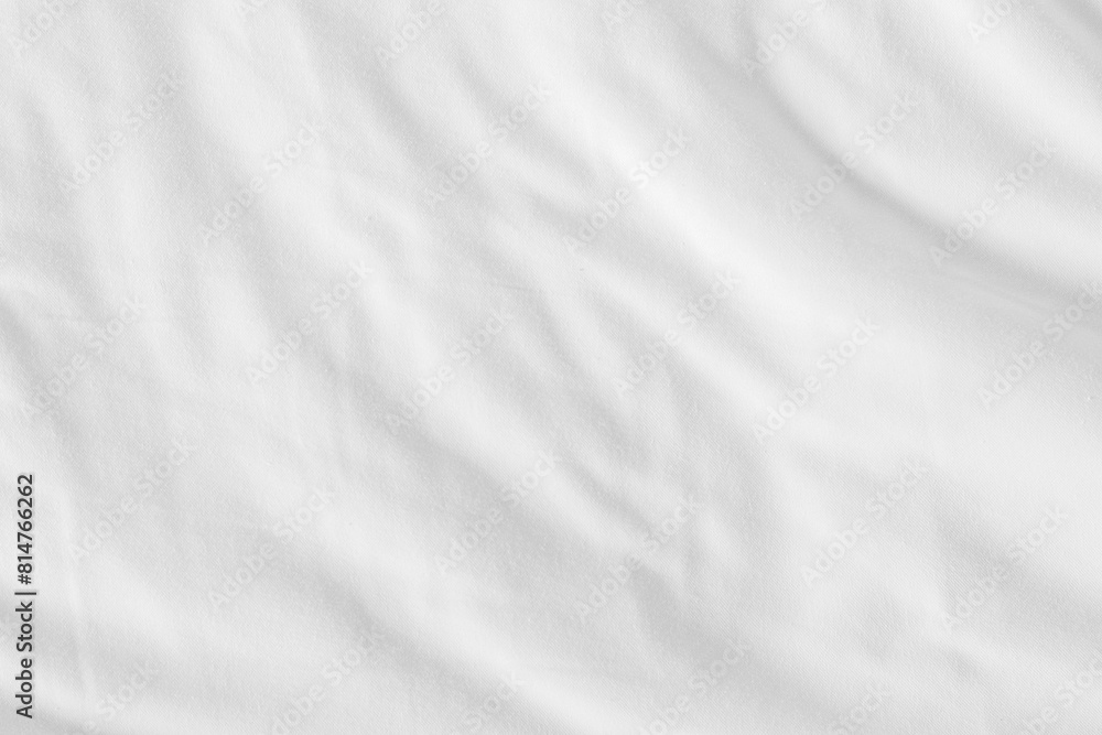 Fototapeta premium Close up white wrinkled fabric texture rippled surface, Soft focus.