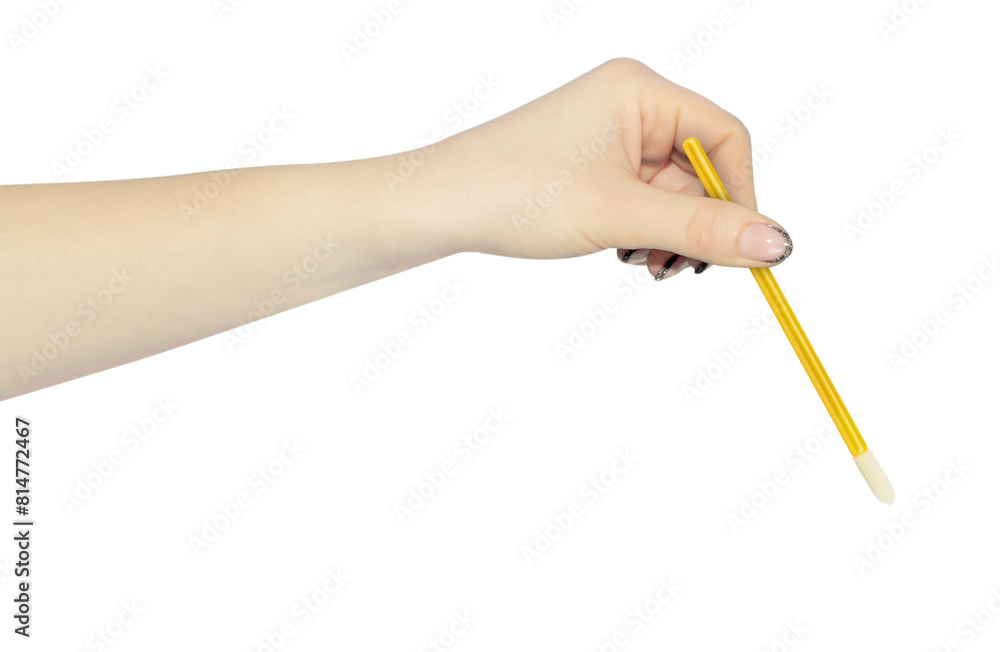 velor eyelash applicator in hand, outstretched hand with velor eyelash applicator isolated from background velor eyelash applicator in hand, outstretched hand with velor eyelash applicator isolated from background