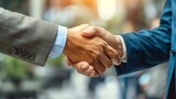 Close-up of a handshake between two businessmen, symbolizing partnership and cooperation, perfect for corporate brochures, business articles, and diversity inclusion campaigns