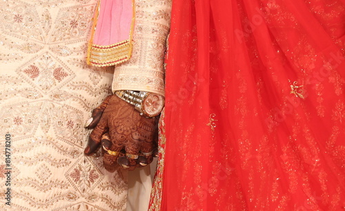 couple holding each others hands in a wedding ceremony photo