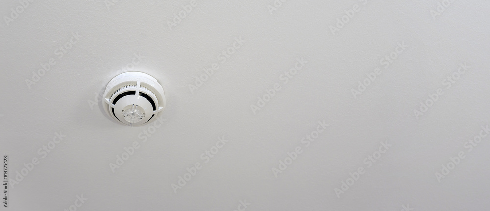 White ceiling mounted fire safety device smoke detector White ceiling mounted fire safety device smoke detector