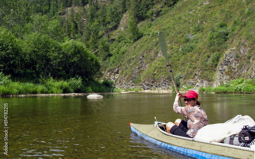 beautiful woman Tourist kayaking on the White River in the Southern Urals in the Republic of Bashkortostan