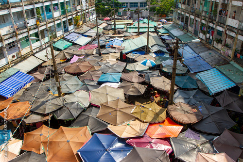 Fotografie View Of Old Apartment And Umbrellas Of Local Market In Central Of Ho Chi Minh City