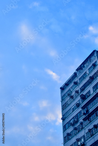 Exterior of residential building in Hong Kong with skyscape. Details of modern architecture. Building abstract.  Building background.
